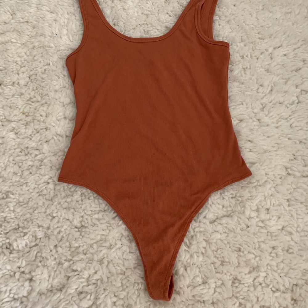 Rusty orange body suit